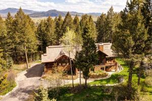 an overhead view of a log home in the woods at Abode at Two Wolves in Teton Village