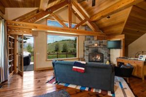 a living room with a couch and a fireplace at Abode at Skyline in Jackson