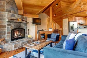 a living room with a couch and a fireplace at Abode at Skyline in Jackson