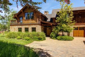 a large wooden house with a balcony on it at Abode at Skyline in Jackson