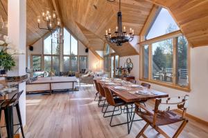 a dining room and living room with a table and chairs at Abode at Golden Spruce in Wilson