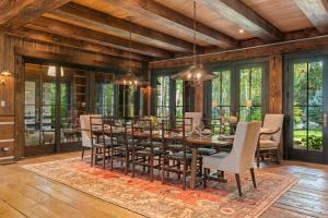 a dining room with a table and chairs at Abode at Teton Game in Wilson