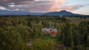 an aerial view of a house in the forest at Abode at Teton Game in Wilson