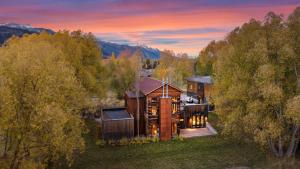 an aerial view of a house in the woods at Abode at Alpenglow in Wilson