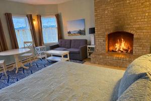 a living room with a fireplace and a couch at The Edenwild Boutique Inn in Lopez +107 photos