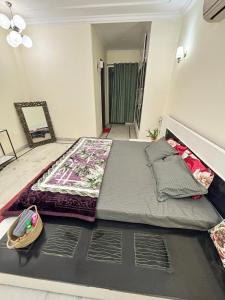 a large bed in the middle of a room at Sparra Homes in Gurgaon