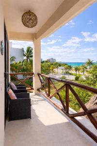a balcony with a view of the ocean at Atenea - Optional Beach Club in Holbox Island
