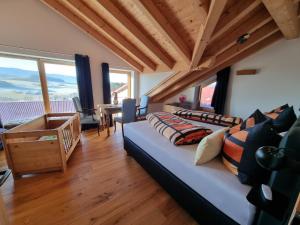a living room with a couch and a table at Chalet Hoamad im Bayerischen Wald in Eschlkam