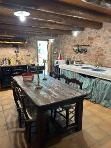 a wooden table in a kitchen with a counter at Molino Santiago in Torre de las Arcas +44 photos