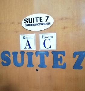 a sign that says suite seven room a sun set at Suite seven &Home Restaurant in Paglieta