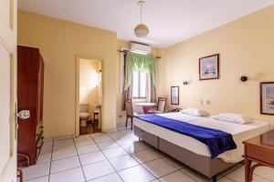a bedroom with a large bed and a bathroom at Daher Center Hotel in São Paulo +80 photos