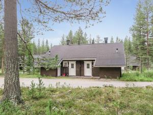a house with a tree in front of it at Holiday Home Kolonen by Interhome in Levi