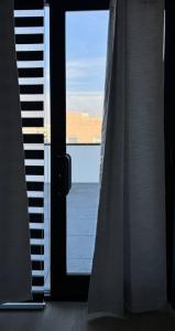 a close up of a window with a view of a keyboard at Stylish Studio Apt-Outside NYC in West New York