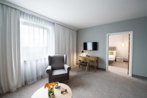 Televízia a/alebo spoločenská miestnosť v ubytovaní ibis Styles Siedlce