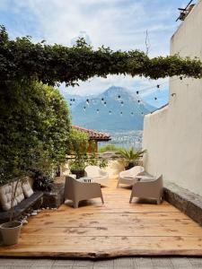 a patio with chairs and a view of a mountain at Residenza Renata in Onno