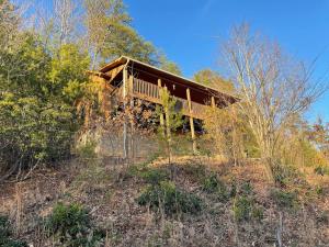 a house sitting on top of a hill at Blushing Bear Stunning Views in Sevierville