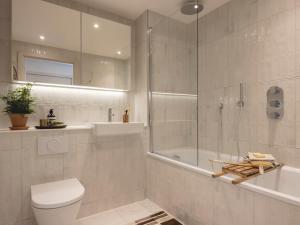 a bathroom with a shower and a toilet and a sink at Charles Hope Cambridge in Cambridge +24 photos