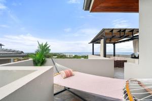 a hammock on the balcony of a house at Panaromic Oceanview Luxury 3BR Private Rooftop in Tamarindo