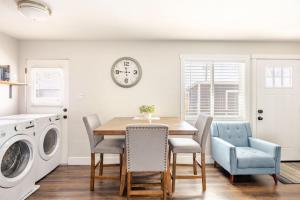 a kitchen and dining room with a table and chairs at 721 Cozy Mid-Town Hideaway in Reno