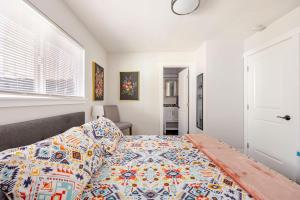 a bedroom with a bed with a quilt on it at 721 Cozy Mid-Town Hideaway in Reno