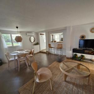 a living room with a table and chairs at Casa Francesca in Saint-Florent