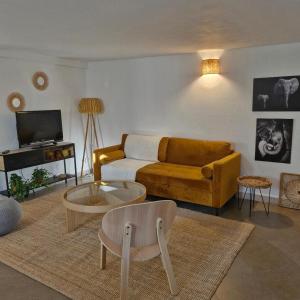 a living room with a couch and a coffee table at Casa Francesca in Saint-Florent