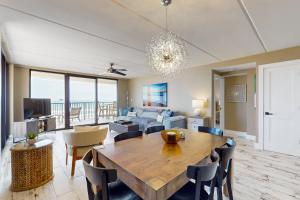 a living room with a table and a couch at Updated 3BR w/ Gulf Views: Suntide III - Unit 801 in South Padre Island
