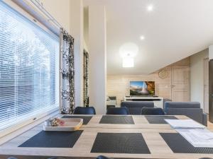 a dining room with a long table and chairs at Holiday Home Levin stara a09 by Interhome in Levi