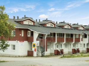 a row of houses with red and white at Holiday Home Levi star 1502 by Interhome in Levi