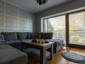 a living room with a couch and a table at Pikk 45 in Otepää