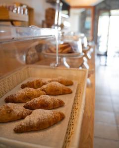 a tray of pastries on a counter in a bakery at Relais Buona Stella in Pimonte