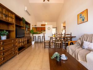 a living room with a couch and a table at Holiday Home D1 by Interhome in Deltebre