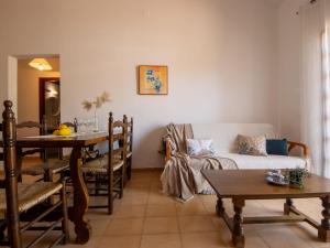 a living room with a couch and a table at Holiday Home D1 by Interhome in Deltebre