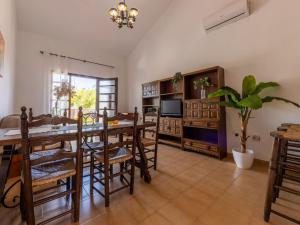 a large living room with a table and chairs at Holiday Home D1 by Interhome in Deltebre +11 photos