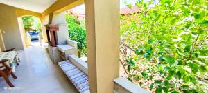 a balcony with a view of a garden at Zach's house in Nea Roda