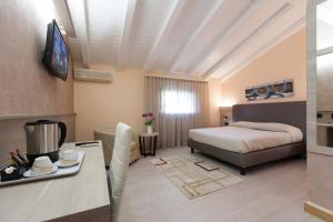 Postel nebo postele na pokoji v ubytování Hotel Prata Verde + 37 fotografií