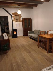a living room with a couch and a table at La Caseta del Ter in San Juan de Mollet +9 photos