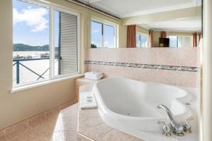 a bathroom with a sink and a large window at Glen Lyon Inn in Port Hardy +35 photos