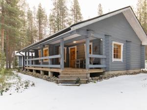 a tiny house in the woods in the snow at Holiday Home Kuusenkolo by Interhome in Pyhätunturi