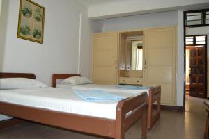 Postel nebo postele na pokoji v ubytování Manson Hotel