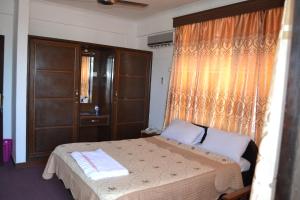 Postel nebo postele na pokoji v ubytování Manson Hotel