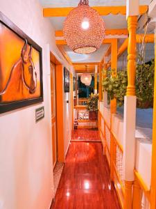 a hallway with a painting of a horse on the wall at Casa Salento in Salento
