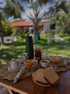 a table with sandwiches and bowls of food on it at La belle de jour in Fortim