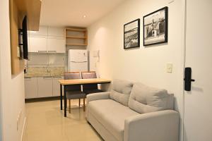 a living room with a couch and a table at Nobile Stays Ininga in Teresina