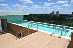 a swimming pool on the roof of a building at Nobile Stays Ininga in Teresina