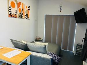 a living room with a couch and a table at Your Harrogate Stay in Harrogate