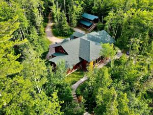 an aerial view of a house in the woods at Sunset Bay Lodge in Abbeyville