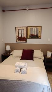 a bedroom with a bed with towels on it at Vinhas das Grutas in Soledade +28 photos
