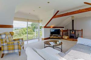 a living room with a couch and a fireplace at 3 Bed in Mumbles oc-b27725 in The Mumbles