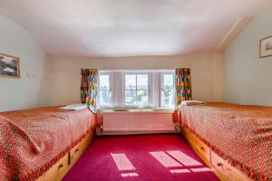 a bedroom with two beds and a window at 2 Bed in Brecon oc-t32728 in Brecon